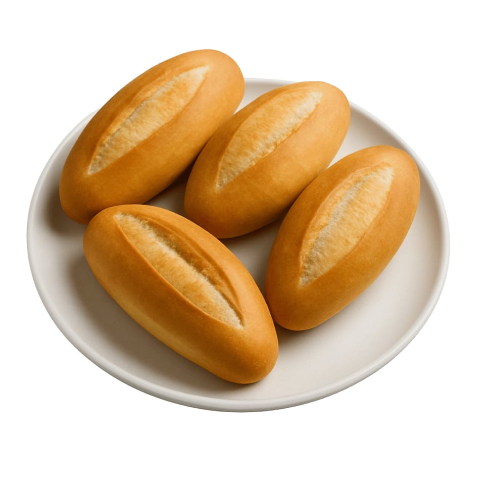 Four golden-brown Vietnamese baguette rolls, known as banh mi, arranged on a white plate.