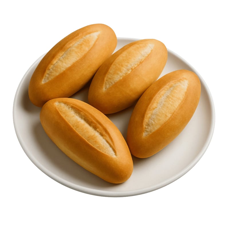 Four golden-brown Vietnamese baguette rolls, known as banh mi, arranged on a white plate.